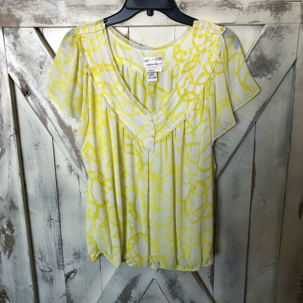 Soft white and yellow flutter sleeve top